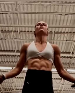 Mari Grossi mid jump-rope set in her gym
