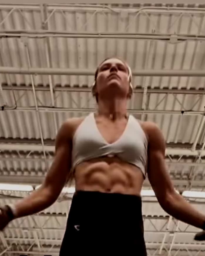 Mari Grossi mid jump-rope set in her gym
